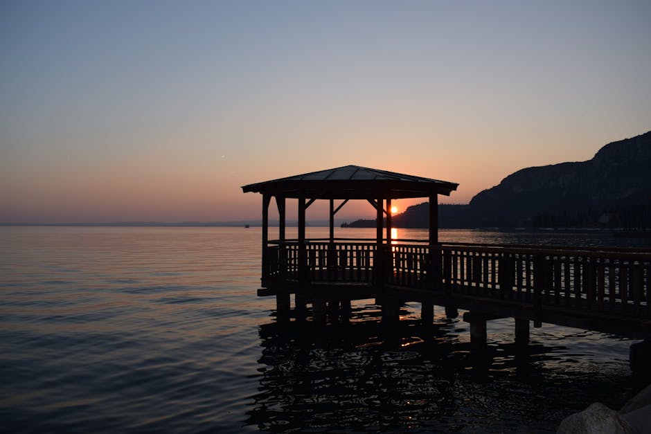 Lake Garda sunset reflection pier