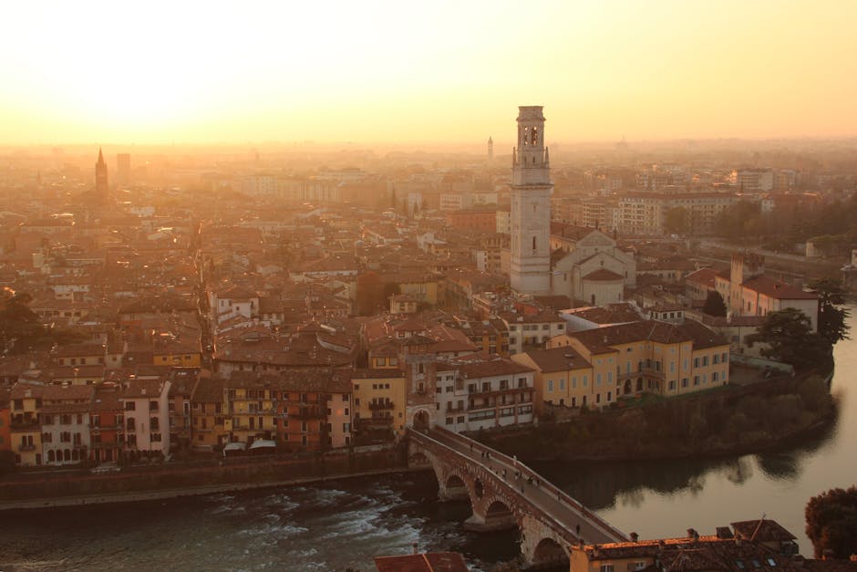 Ponte Pietra river reflection golden hour
