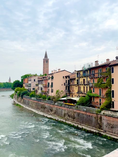 Verona evening riverside walking couple