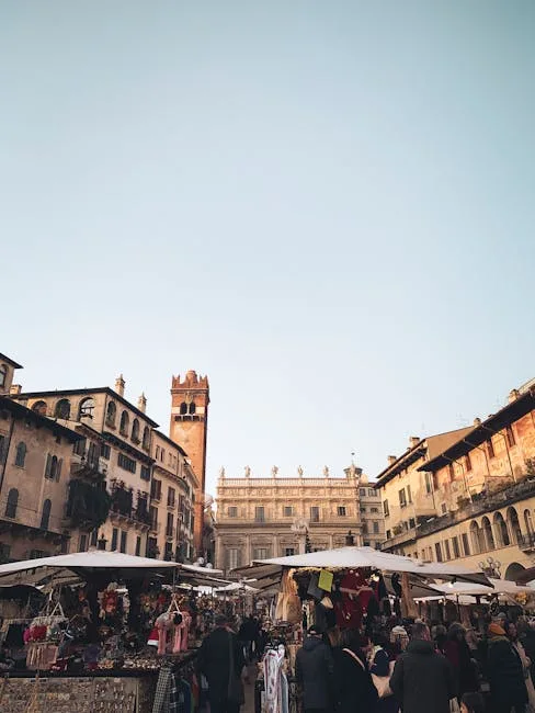 Marché animé sur la Piazza delle Erbe à Vérone, étals et foule.
